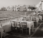 Cafe , Mykonos Greece #YNL-557.  Black-White Photograph,  Stretched and Gallery Wrapped, Limited Edition Archival Print on Canvas:  40 x 44 inches, $1530.  Custom Proportions and Sizes are Available.  For more information or to order please visit our ABOUT page or call us at 561-691-1110.